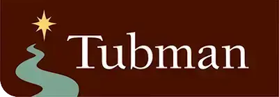 A brown rectangular logo with a winding green path leading to a yellow star on the left, and the word Tubman in large white letters on the right, representing estate planning Minnesota services.