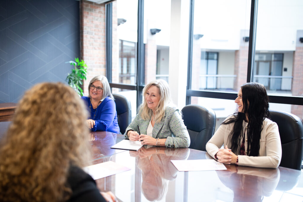 Everbright Legacy Law team members meeting together in the conference room