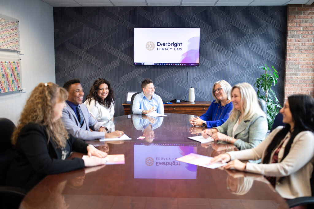 Joshua Perry-Barnes and Michelle Zavala with Everbright Legacy Law team members at a conference table