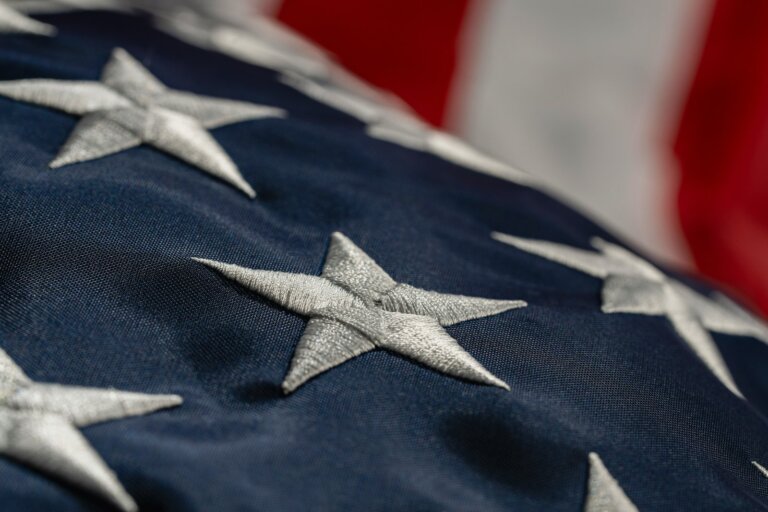 Close-up of embroidered stars on an American flag